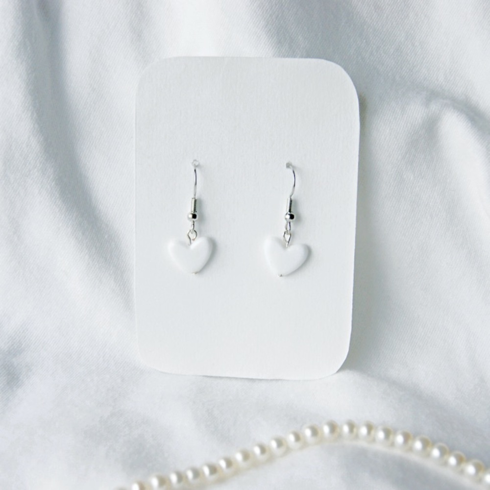 White hearts dangle earrings